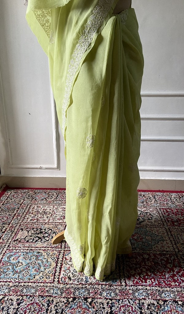Pallu of the lime green saree, chikankari worked across it