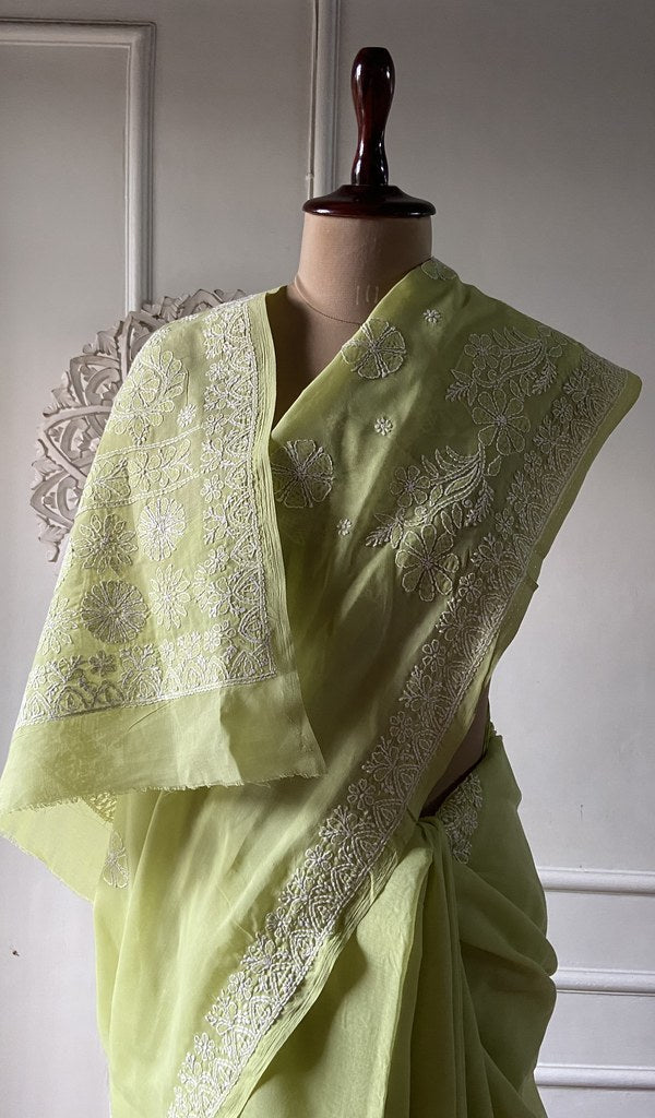 Lime green saree draped to show the fall of the fabric
