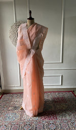 Load image into Gallery viewer, Peach cotton voile chikankari saree draped on the mannequin