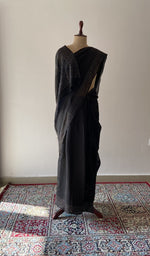 Black pure organza silk saree draped on the mannequin