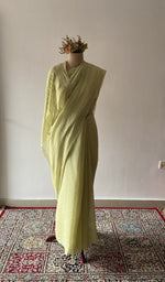 Green pure mul chanderi saree draped on the mannequin