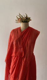 The pallu falling over the shoulder