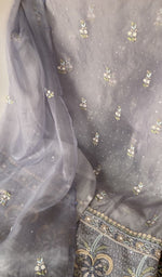 Beads and cutdana along the placket