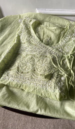 green pure mul chanderi chikankari suit set, folded