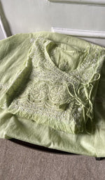 border and hem of the green kurta piece