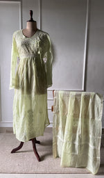 green pure mul chanderi chikankari set on the mannequin with the dupatta