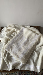 Off white pure mul chanderi kurta piece folded, fine chikankari with paisley motifs