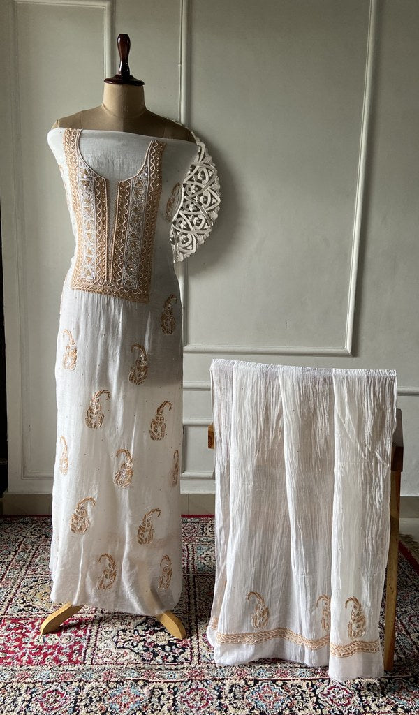 white pure mul chanderi chikankari 2 pc unstitched suit set on mannequin