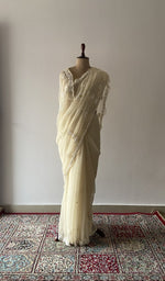 Cream faux georgette saree draped on the mannequin