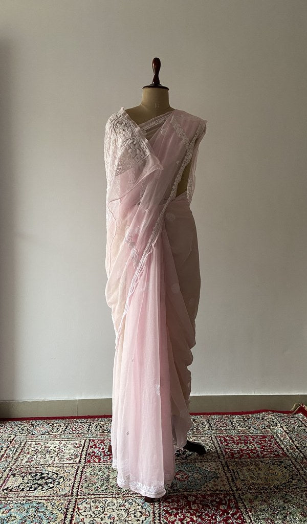 Pale pink faux georgette saree draped on the mannequin