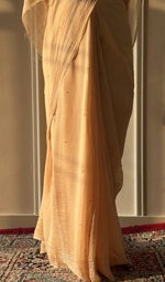 Fine chikankari on border and palla on the golden beige saree