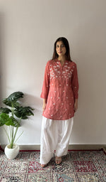 Rust stitched short kurti on the model, full length, front
