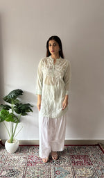 Green stitched short kurti on the model, full length, front