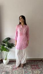 Baby Pink stitched short kurti on the model, full length, front