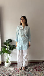 Blue stitched short kurti on the model, full length, front