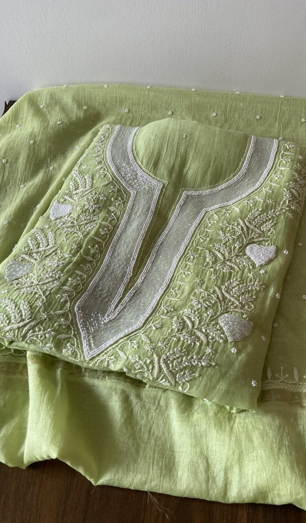 Lime Green pure mul chanderi kurta piece folded, fine chikankari in view