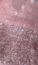 The dusty pink kurta, spread out flat