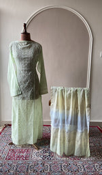 Sage green mul chanderi set on the mannequin with its dupatta
