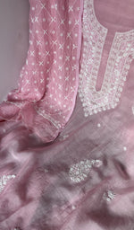 Motifs across the body of the pink kurta