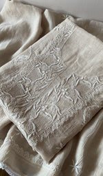 Folded green pure mul chanderi kurta piece with chikankari on the panel