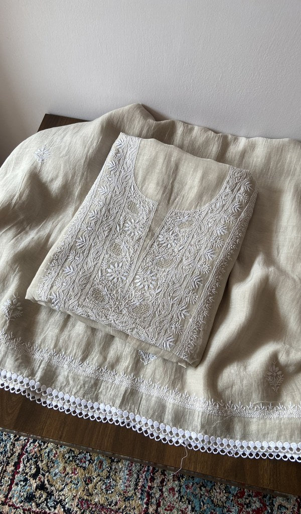 Folded white pure mul chanderi kurta piece with chikankari on the panel