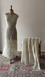 White pure mul chanderi chikankari suit set on the mannequin with its dupatta