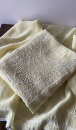 Folded kurta piece and dupatta, chikankari along the hem