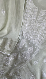 Green pure mul chanderi chikankari suit set on the mannequin with its dupatta