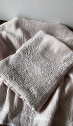 Folded kurta piece and dupatta, chikankari along the hem