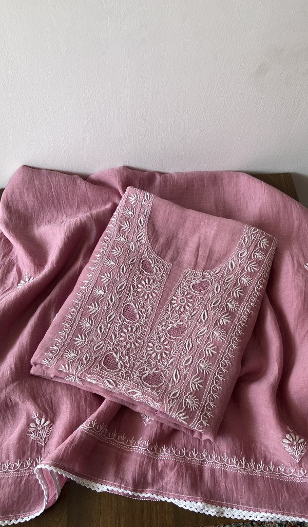 Folded pink pure mul chanderi kurta piece with chikankari on the panel