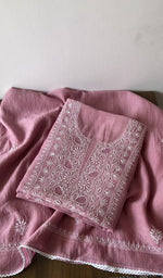 Folded pink pure mul chanderi kurta piece with chikankari on the panel