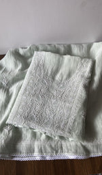 Folded green pure mul chanderi kurta piece with chikankari on the panel