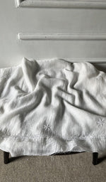 Bottom fabric draped over the stool