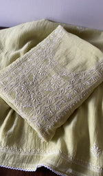 Folded kurta piece and dupatta, chikankari along the hem
