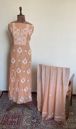 The set on the mannequin with its dupatta beside it