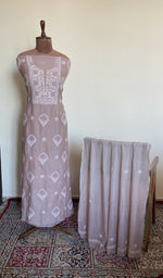 The set on the mannequin with its dupatta beside it