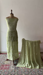 The set on the mannequin with its dupatta beside it