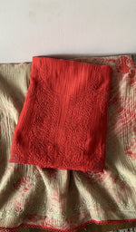 Red pure mul chanderi kurta piece folded, fine chikankari with elephant motifs and haath ki jaali