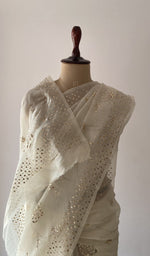 Off white pure organza silk saree draped on the mannequin