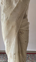 Border along the edge, allover jaal badla and mukaish work with rose motifs