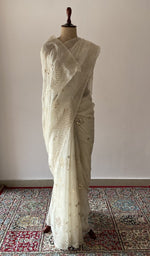 Allover jaal badla and mukaish work with rose motifs across the pallu