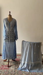 The set on the mannequin with its dupatta beside it