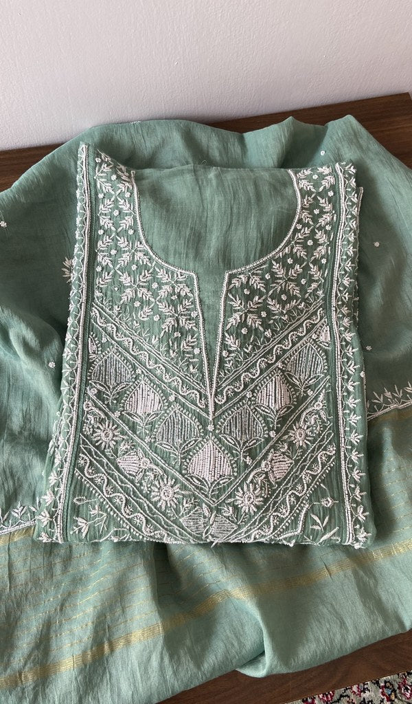 Green pure mul chanderi kurta piece folded, fine front and back jaaldar chikankari anarkali