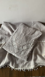 Folded grey pure mul chanderi kurta piece with chikankari on the panel