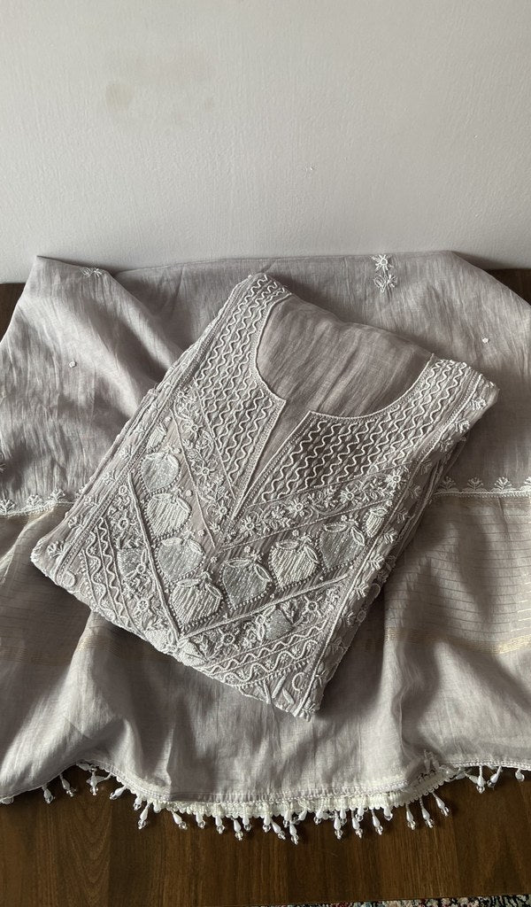 Folded grey pure mul chanderi kurta piece with chikankari on the panel