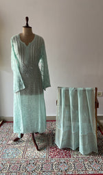 The set on the mannequin with its dupatta beside it