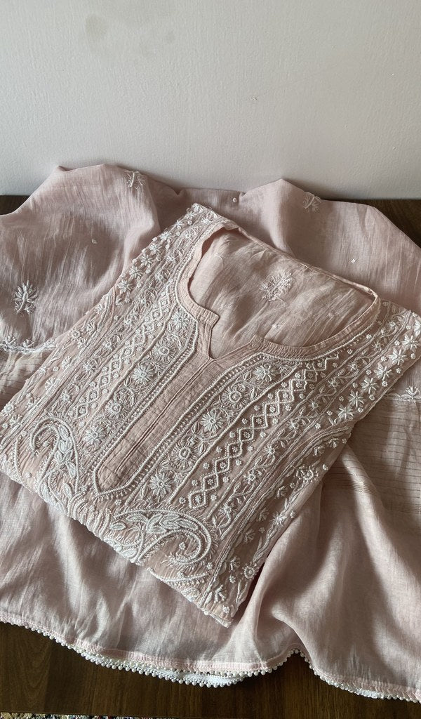 Folded pink pure mul chanderi kurta piece with chikankari on the panel