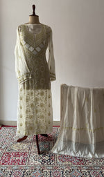 The set on the mannequin with its dupatta beside it