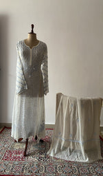 The set on the mannequin with its dupatta beside it