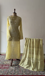 Yellow pure mul chanderi chikankari suit set on the mannequin with its dupatta